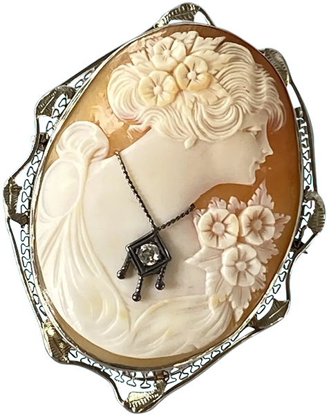 Vintage habillé cameo brooch featuring a carved woman with floral details and a diamond necklace, set in 14k white gold filigree.